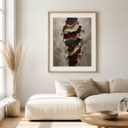 Framed abstract art piece on a wall above a beige sofa in a living room.